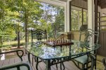glass table off of screened in porch